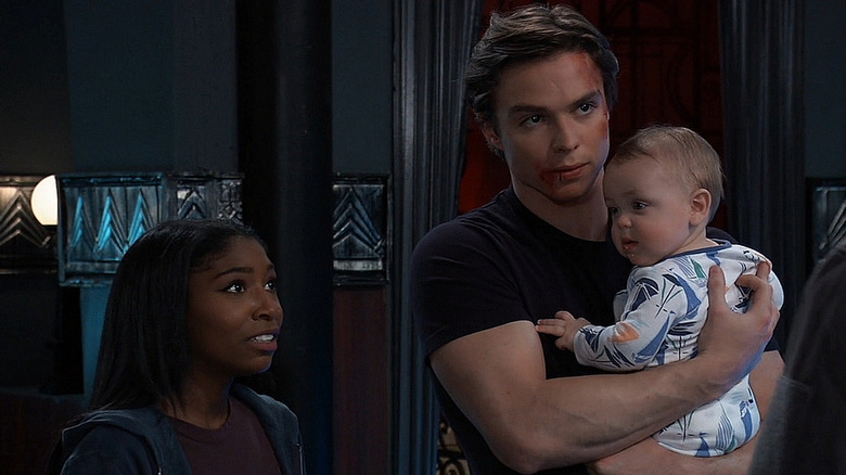 Trina, Spencer, and baby Ace looking worried