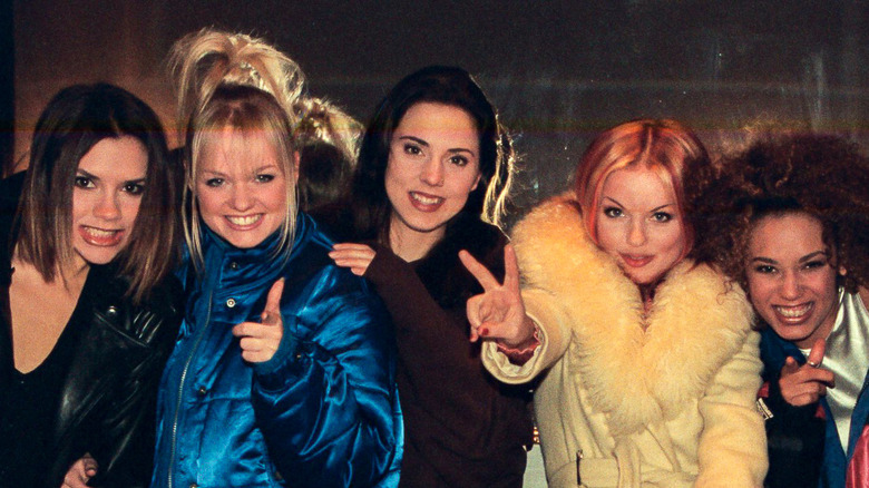 Spice Girls posing together Victoria Beckham, Emma Bunton, Mel C, Mel B, Geri Horner