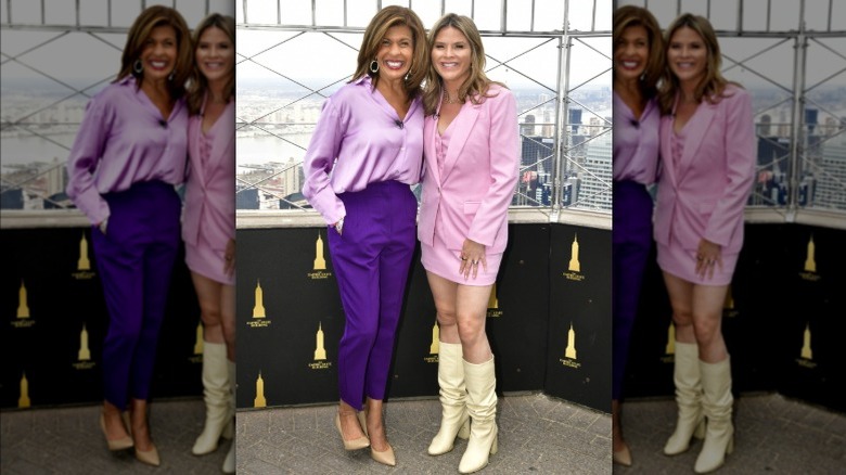 Hoda Kotb and Jenna Bush Hager smiling at the top of the Empire State Building