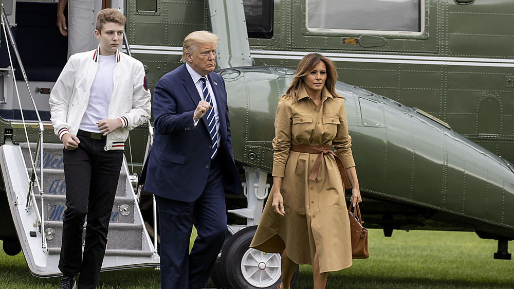 Donald, Melania, and Barron Trump walk together