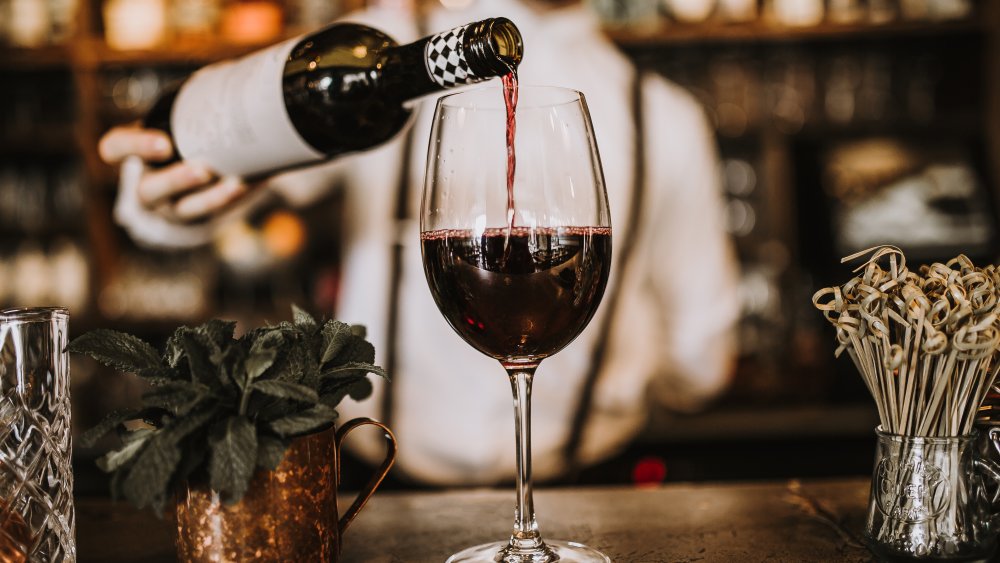 Bartender pouring wine