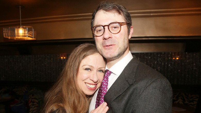 Chelsea Clinton putting her head on Marc Mezvinsky's shoulder