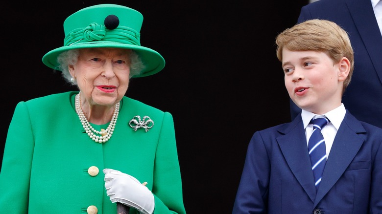 Queen Elizabeth smiling with Prince George