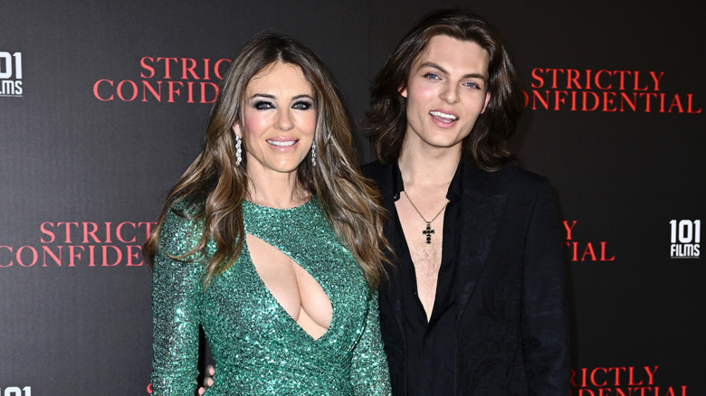 Elizabeth Hurley and Damian Hurley posing at on the red carpet of a "Strictly Confidential" screening.