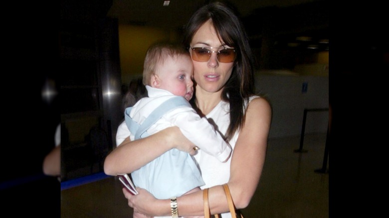 Elizabeth Hurley carrying baby Damian Hurley.