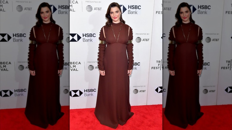 Rachel Weisz in a brown dress on a red carpet in New York City