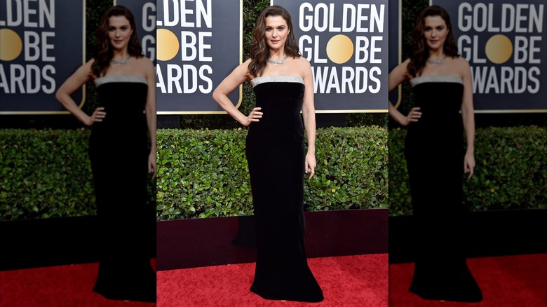 Rachel Weisz in a black velvet dress with silver ruffle on the red carpet