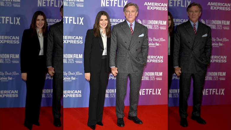 Rachel Weisz in a black suit with Daniel Craig in a gray suit on the red carpet
