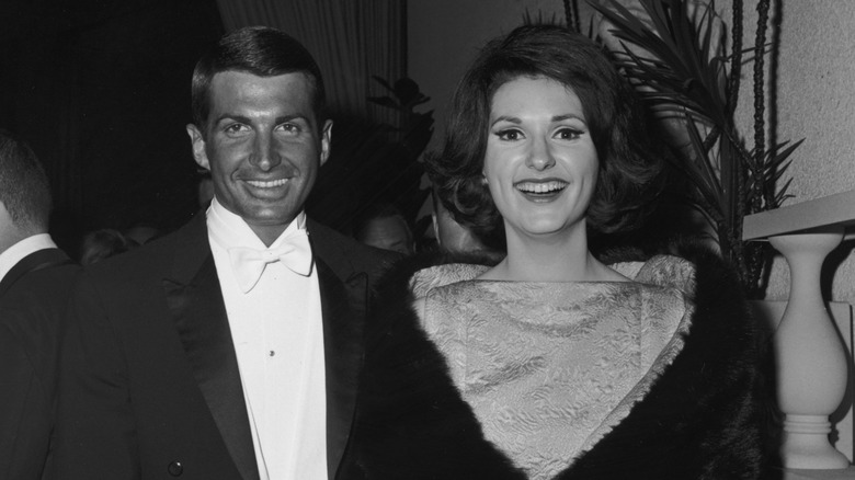 George Hamilton and Lynda Bird Johnson attend the 1966 Academy Awards