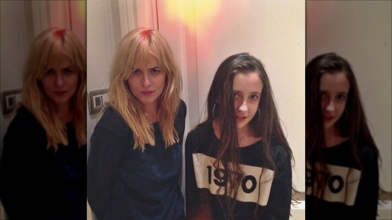 Dakota Johnson and Angelica Jopling posing