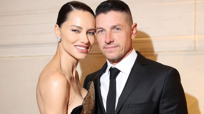 Adriana Lima posing with Andre Lemmers