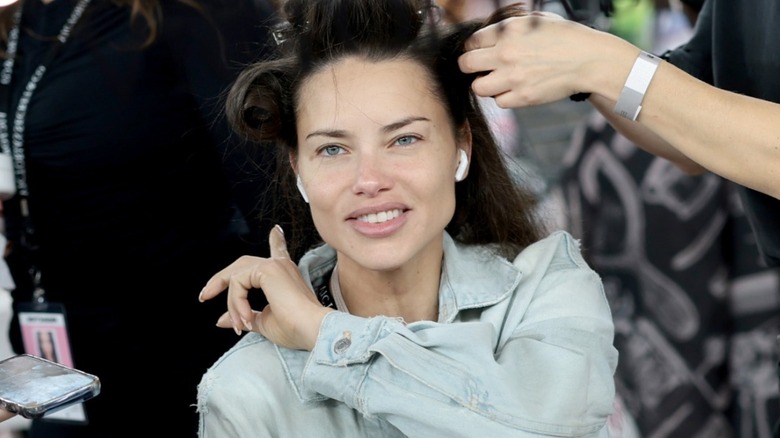 Adriana Lima backstage getting her hair done at Victoria's Secret