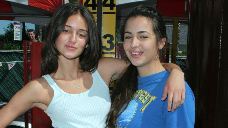 Young Alanna Masterson outside