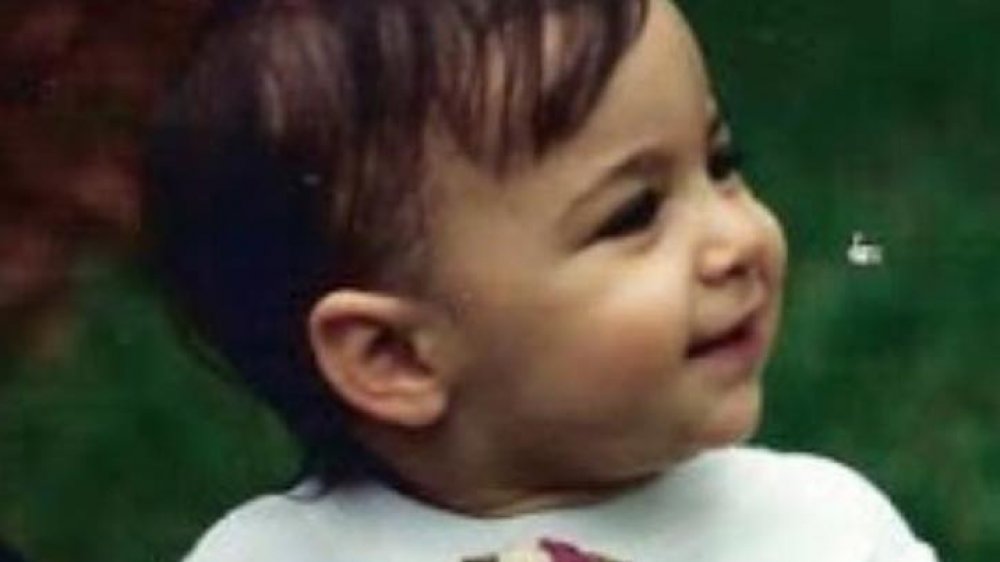 Aly Raisman as a young girl with a trophy