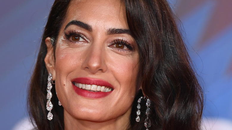 Amal Clooney wearing red lipstick