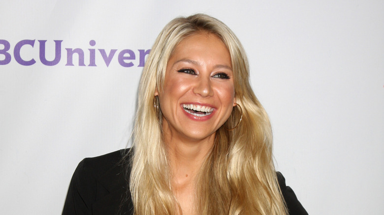 Anna Kournikova smiling at an event in 2011