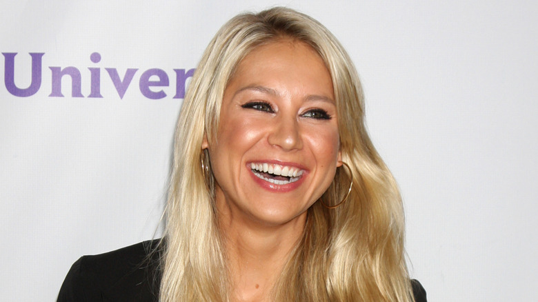 Anna Kournikova smiling at an event in 2011