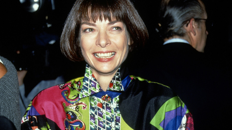 Anna Wintour smiling at a party in 1990 NYC.