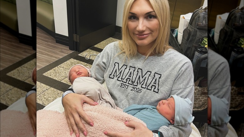 Brooke Hogan holding her twins, Mollie and Oliver