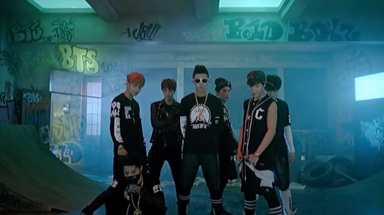 BTS posing in a music video.