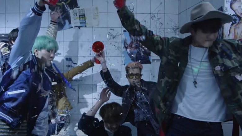 BTS performing in a music video.