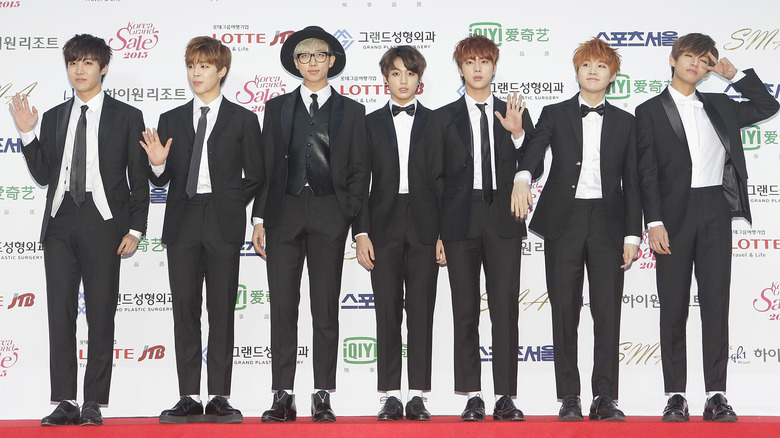 BTS posing in formalwear.