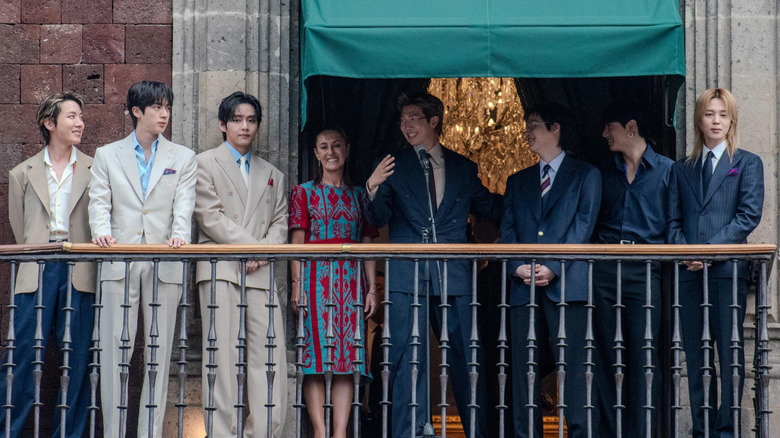 BTS standing with the President of Mexico, Claudia Sheinbaum, in May 2026