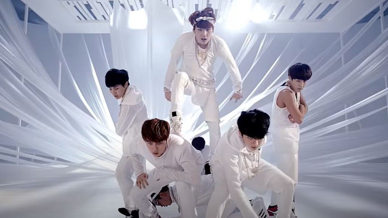BTS performing in a music video.