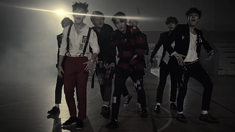 BTS performing in a music video.