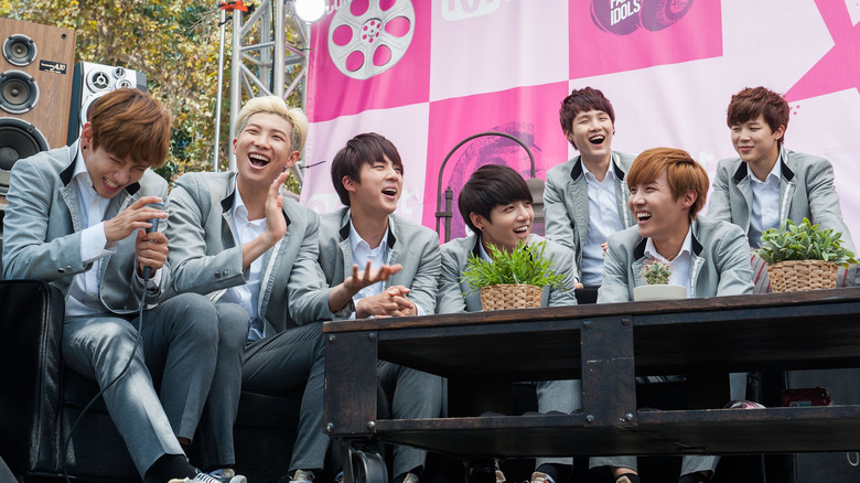 BTS laughing and smiling.