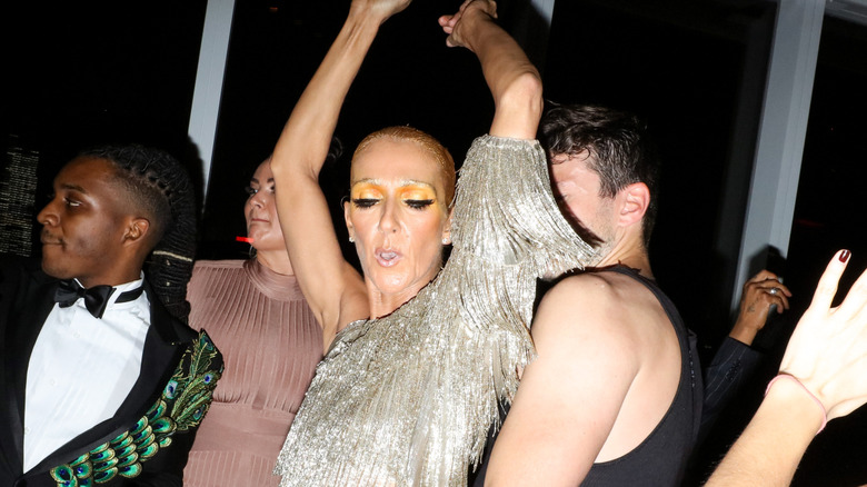 Celine Dion dancing in silver dress