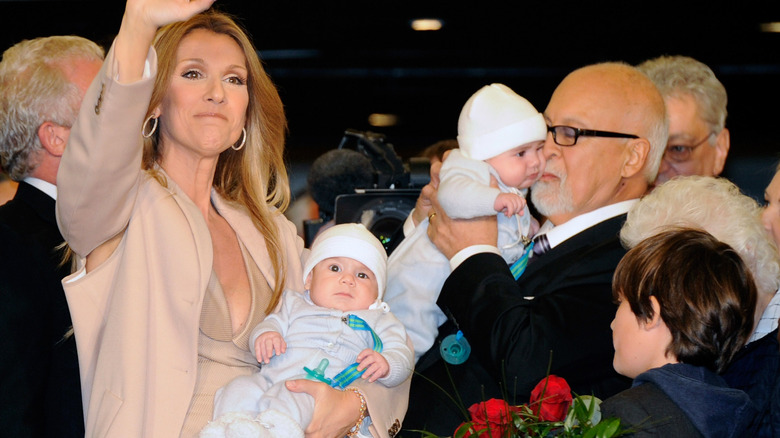 Celine Dion waving with her babies