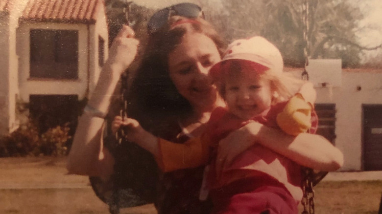 Young Christina Aguilera, mom on swings