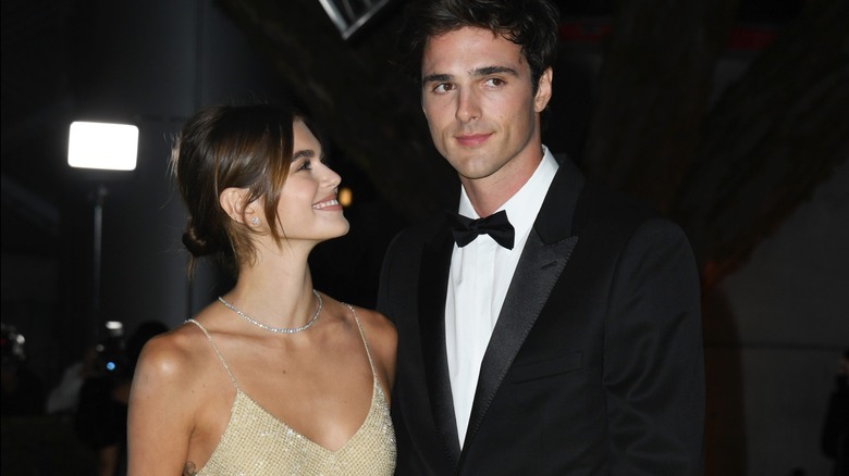 Kaia Gerber looking up and smiling at Jacob Elordi.