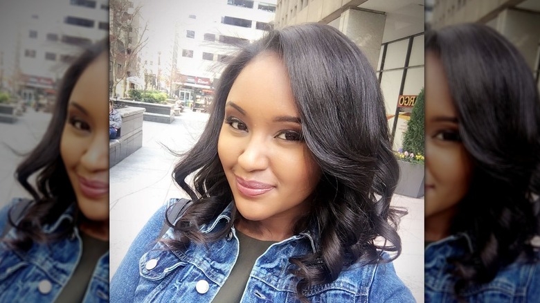 Rahel Solomon smiles in a selfie outside showing off her new hair.