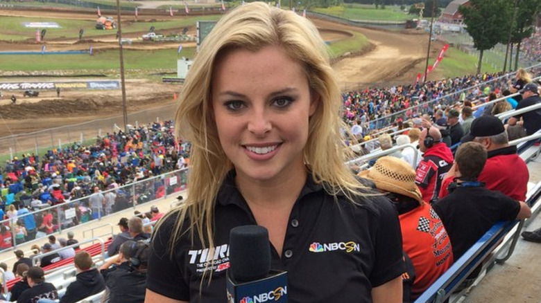 Cristy Lee holding NBCSN mic in stadium