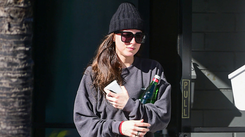 Dakota Johnson walking in casual wear through streets of LA
