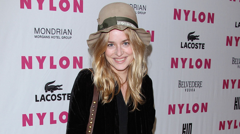 Dakota Johnson posing on step-and-repeat