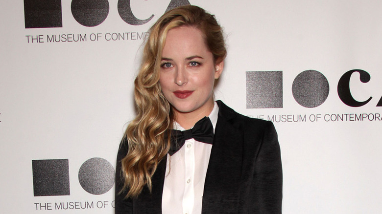 Dakota Johnson posing on step-and-repeat