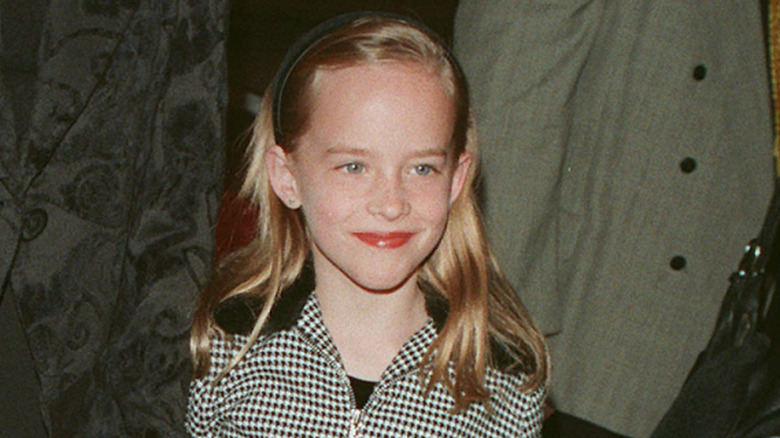 A young Dakota Johnson at event