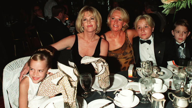 Dakota Johnson, Melanie Griffith, Tippi Hedren, and family at formal dinner in 1990s