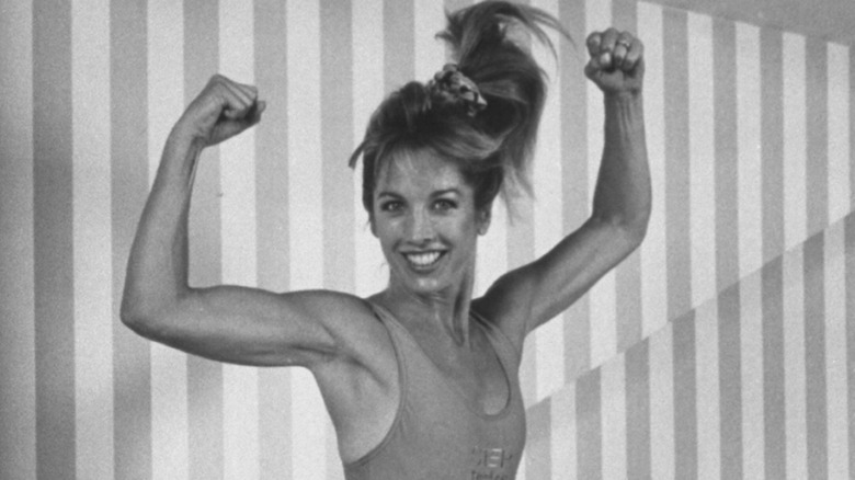 Denise Austin lifting arms in a pose