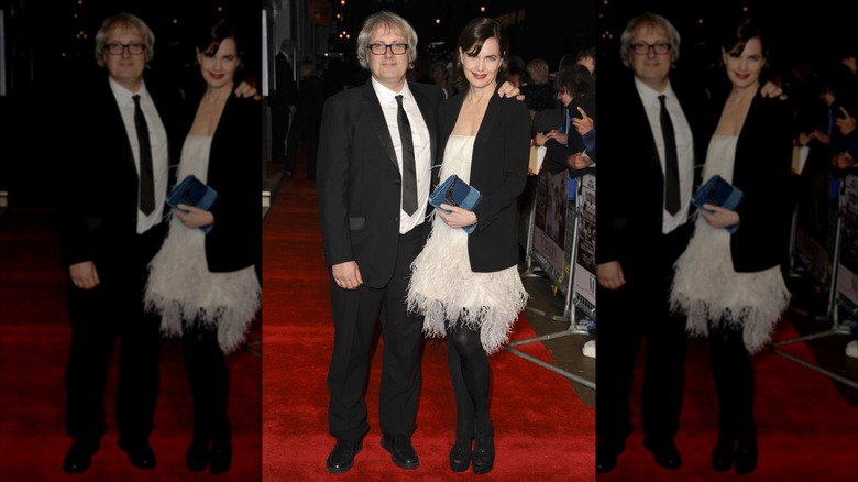 Simon Curtis and Elizabeth McGovern posing on a red carpet
