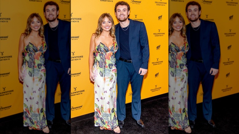 Kai Caster posing with his arm around Natalie Alyn Lind.