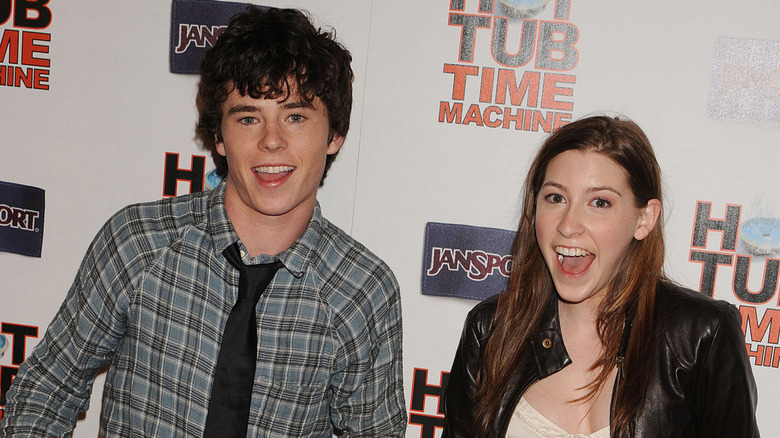 Eden Sher and Charlie McDermott smiling at the "Hot Tub Time Machine" premiere in 2010
