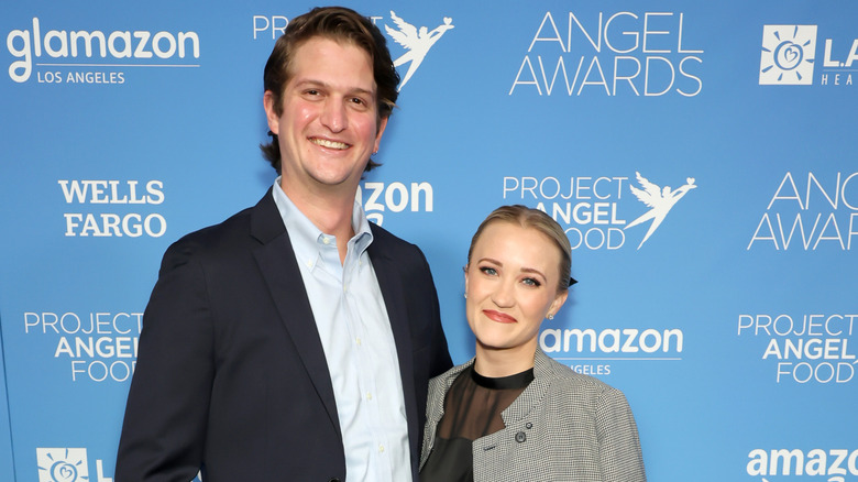 Jack Anthony and Emily Osment posing on step-and-repeat