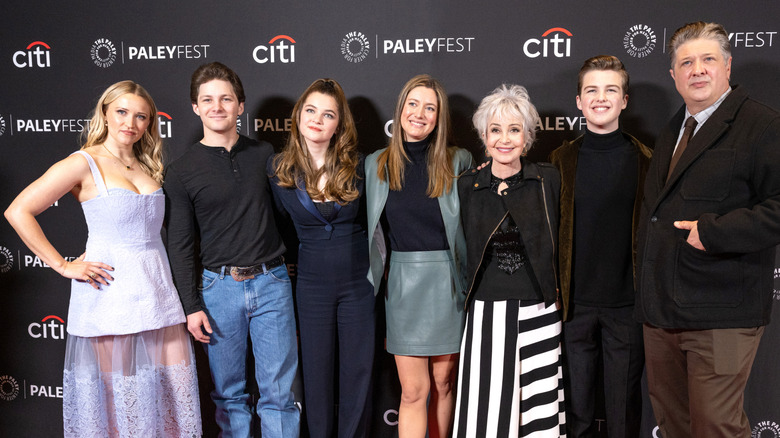 The cast of Young Sheldon posing on step-and-repeat