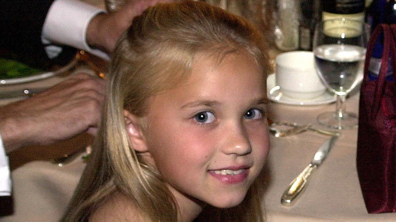 Emily Osment smiling as a child
