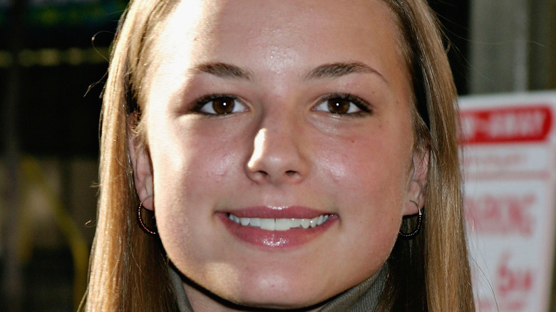 A younger Emily VanCamp smiling