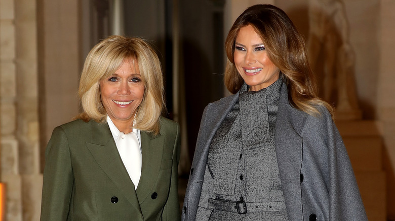 Close-up of Brigitte Macron and Melania Trump smiling together